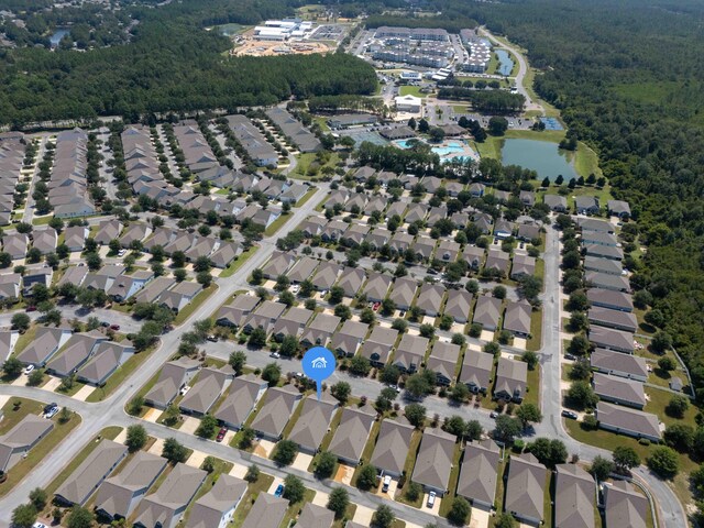 birds eye view of property with a residential view