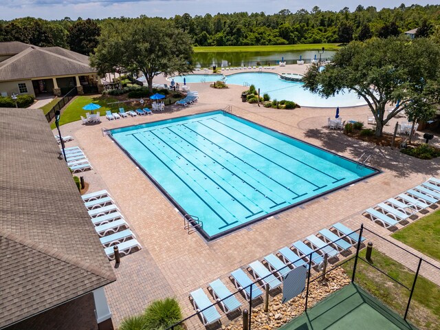 view of swimming pool with a water view