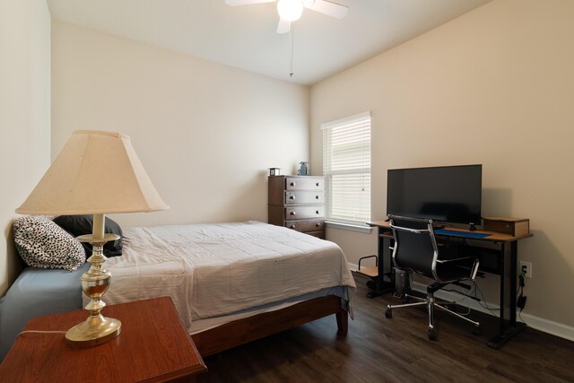 bedroom with ceiling fan and dark wood-type flooring