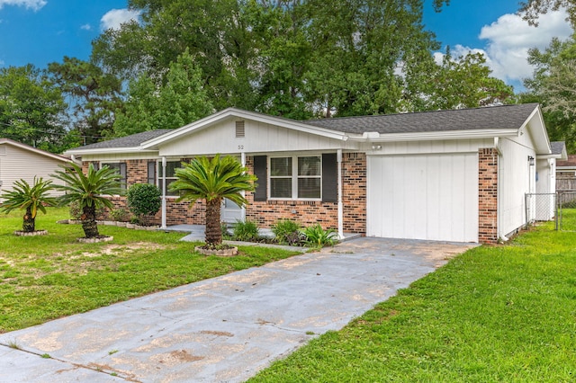 ranch-style home with a garage and a front yard