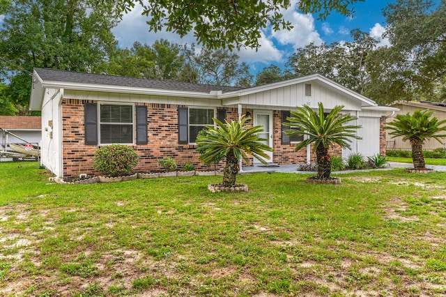 ranch-style home featuring a front yard