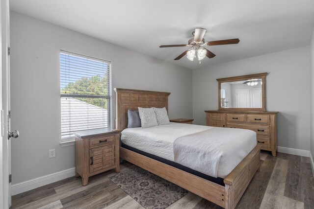 bedroom with hardwood / wood-style flooring and ceiling fan