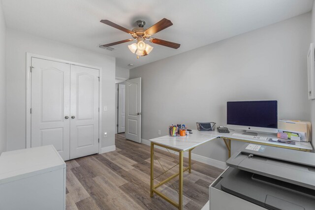 office featuring ceiling fan and light hardwood / wood-style flooring