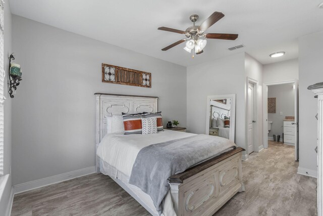 bedroom featuring light hardwood / wood-style floors and ceiling fan