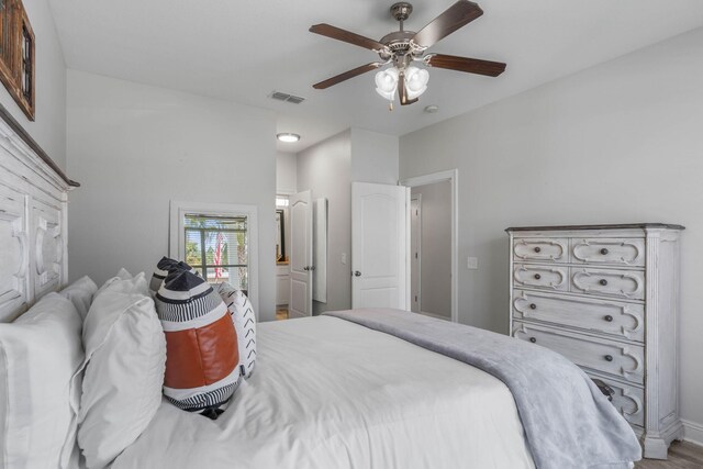 bedroom with ceiling fan and hardwood / wood-style flooring