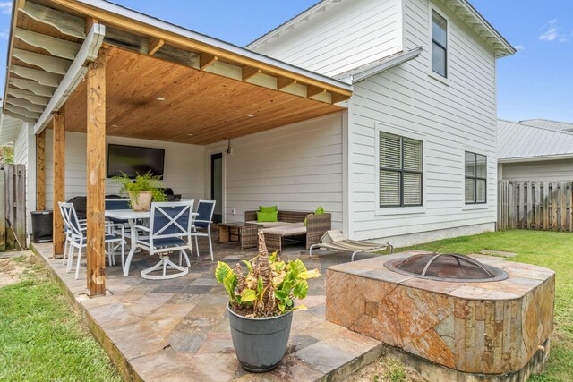 view of patio / terrace with a fire pit