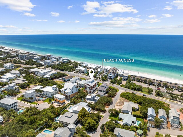 bird's eye view with a beach view and a water view