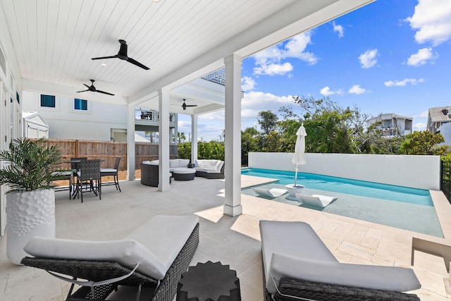 exterior space featuring a fenced in pool, an outdoor hangout area, and ceiling fan