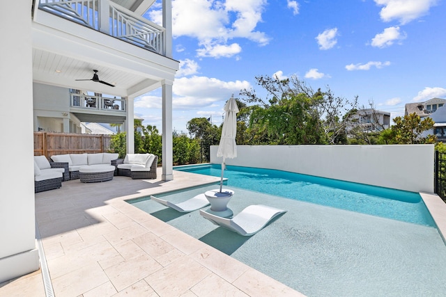 view of swimming pool featuring a patio area, fence, an outdoor hangout area, and a fenced in pool