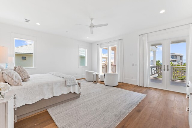 bedroom featuring access to exterior, french doors, ceiling fan, and light hardwood / wood-style floors