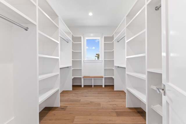 walk in closet featuring light hardwood / wood-style flooring