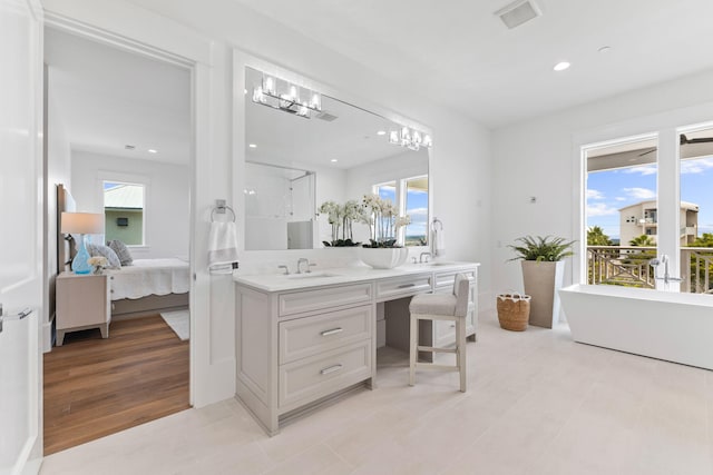 full bathroom featuring vanity, visible vents, a wealth of natural light, and ensuite bathroom