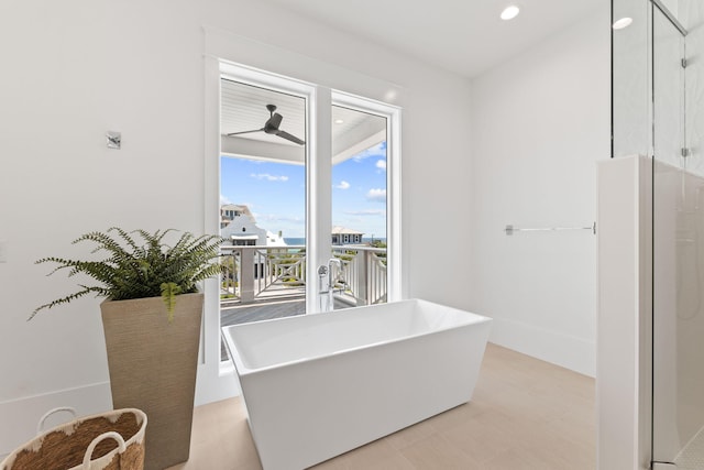 interior space with a ceiling fan and recessed lighting