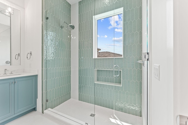 bathroom featuring a stall shower and vanity