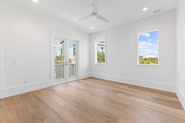 unfurnished room featuring ceiling fan, french doors, and light hardwood / wood-style flooring