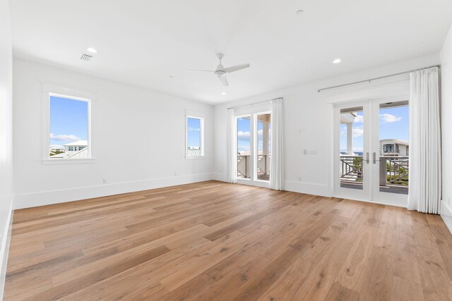 unfurnished room featuring light hardwood / wood-style flooring and ceiling fan