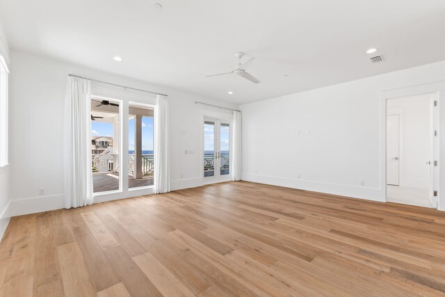 unfurnished room featuring ceiling fan and light wood-type flooring