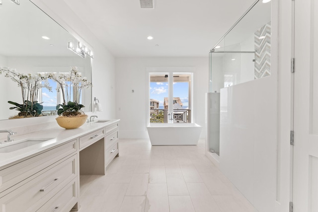 bathroom featuring tile patterned flooring, separate shower and tub, and double sink vanity