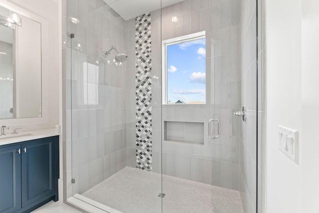 bathroom with vanity and an enclosed shower