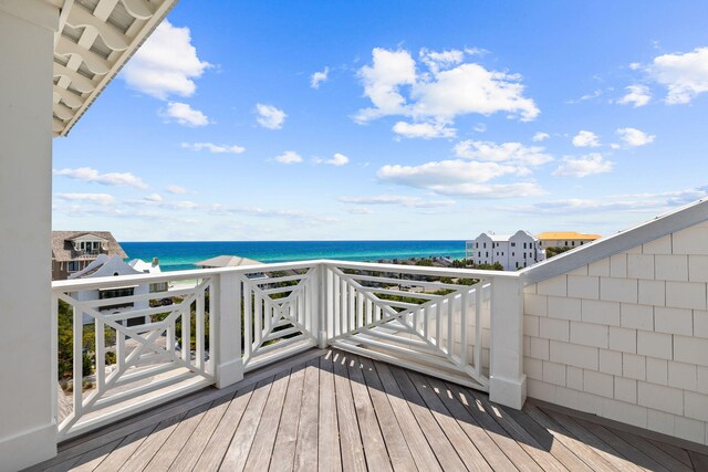 wooden deck with a water view