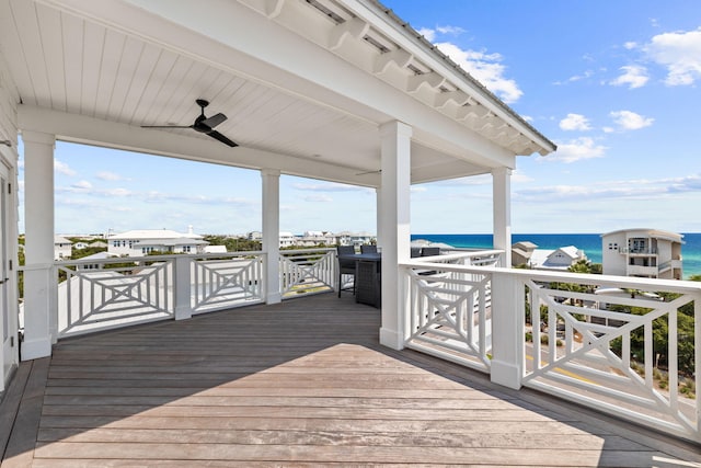 wooden deck featuring a water view