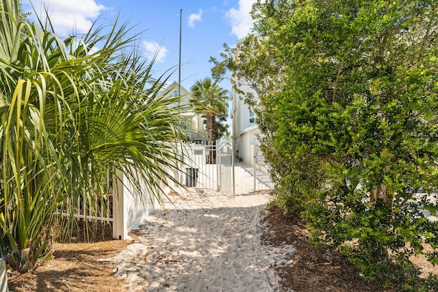 view of gate with fence