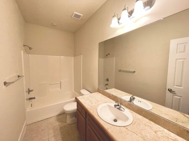 full bathroom featuring bathing tub / shower combination, tile patterned flooring, vanity, and toilet