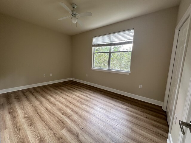 unfurnished bedroom featuring ceiling fan and light hardwood / wood-style flooring