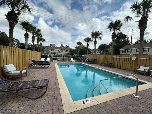 view of swimming pool featuring a patio