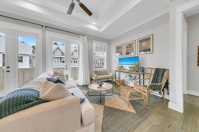 living room featuring french doors, wood-type flooring, plenty of natural light, and ceiling fan