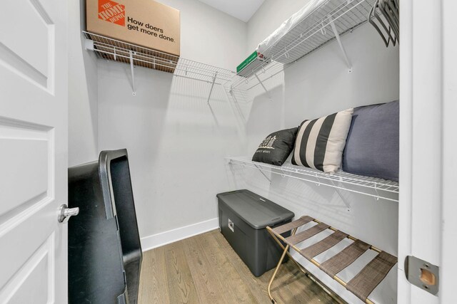 walk in closet featuring hardwood / wood-style floors