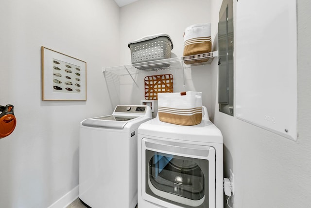 clothes washing area with washing machine and clothes dryer