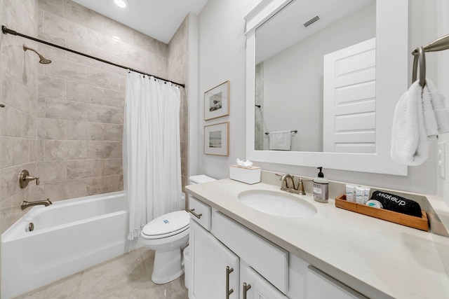 full bathroom with vanity, toilet, and shower / bath combo