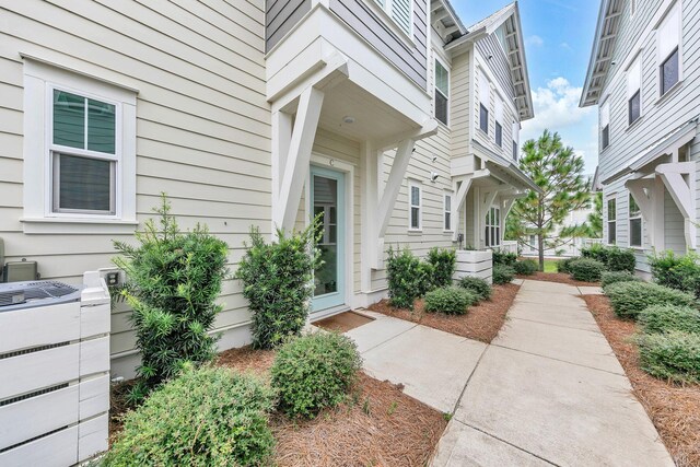 entrance to property featuring central AC unit