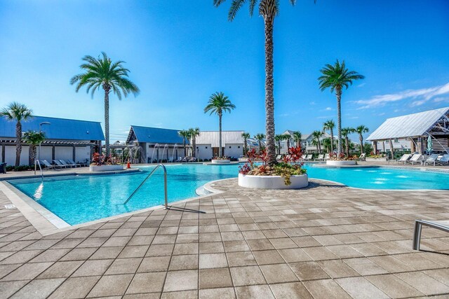 view of swimming pool with a patio