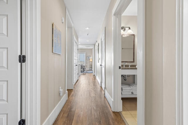 corridor featuring wood-type flooring