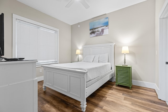 bedroom featuring hardwood / wood-style floors and ceiling fan