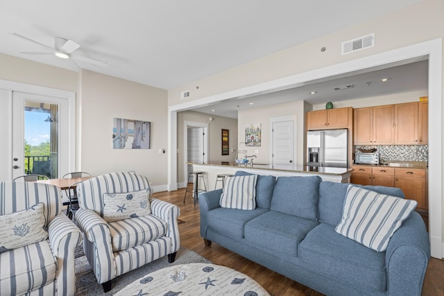 living room featuring visible vents, a ceiling fan, recessed lighting, and dark wood-style flooring