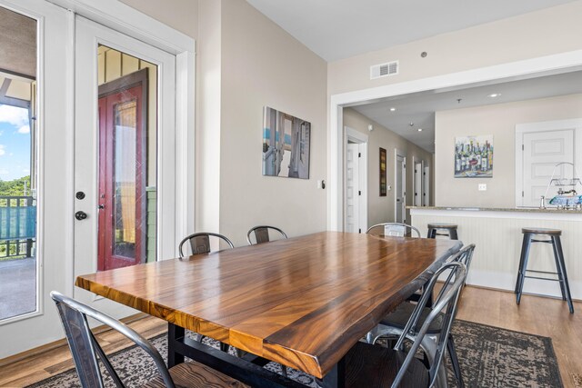 dining area with light hardwood / wood-style floors