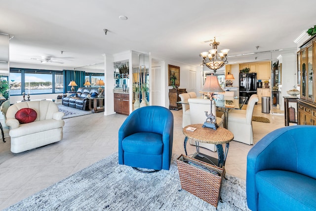 tiled living room featuring ceiling fan with notable chandelier