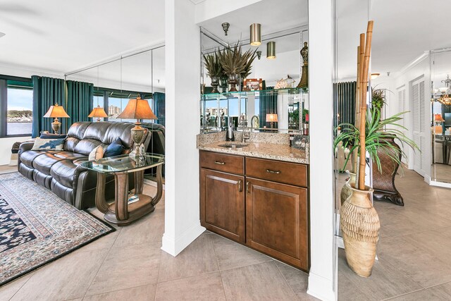 interior space featuring ornamental molding and sink