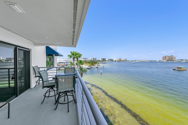 balcony featuring a water view