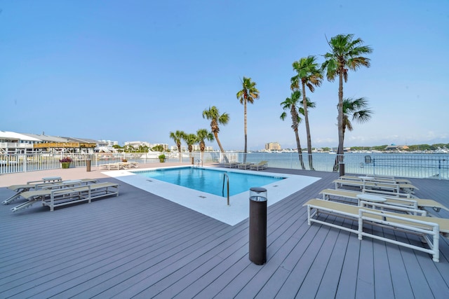 view of pool with a water view