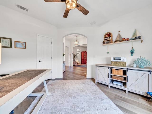 interior space featuring ceiling fan and light wood-type flooring