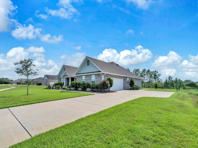 view of front of home with a front yard and a garage