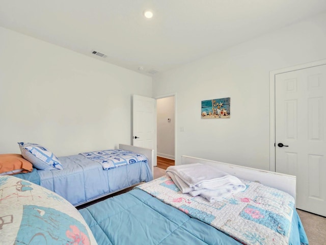 bedroom with light hardwood / wood-style floors