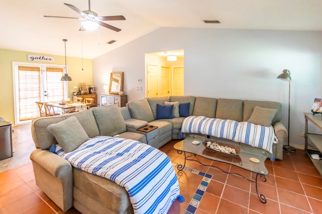 tiled living room featuring ceiling fan and lofted ceiling