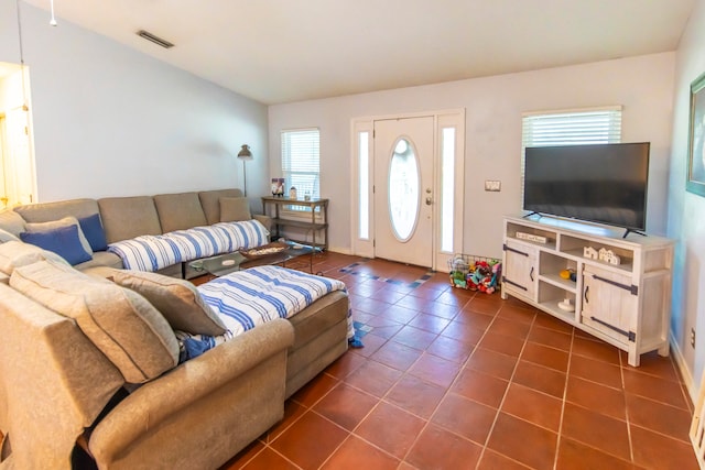 tiled living room featuring a wealth of natural light