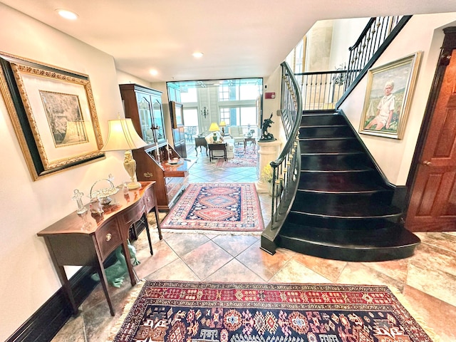 staircase featuring french doors and tile patterned flooring