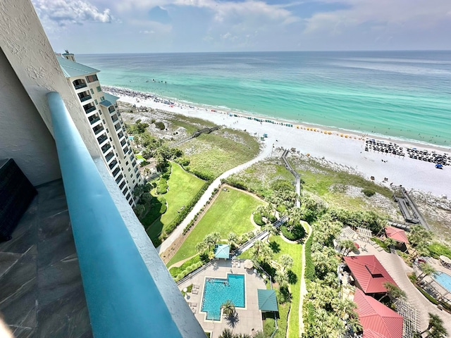 drone / aerial view featuring a water view and a beach view